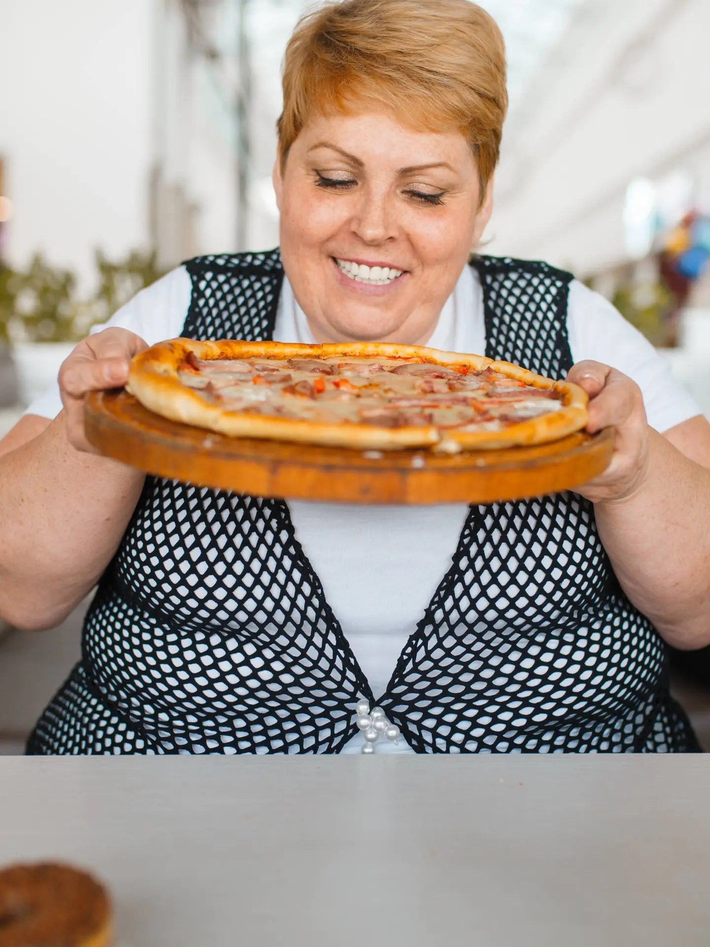 fat-woman-eating-pizza-unhealthy-food-2024-12-01-07-31-41-utc-1